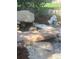 Pond with a statue, plants, and a stone bridge at 2105 Keota Ln, Superior, CO 80027