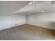 A spacious basement with neutral carpet and ample room for activities and storage at 7292 Firethorn, Littleton, CO 80125