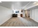 Finished basement area with stone bar, neutral carpet, recessed lights, and storage area at 7292 Firethorn, Littleton, CO 80125