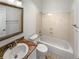Well-lit bathroom features a granite countertop vanity and shower over tub combination at 7292 Firethorn, Littleton, CO 80125