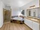Luxurious bathroom with a soaking tub, walk-in shower, and a modern vanity with granite countertops at 7292 Firethorn, Littleton, CO 80125
