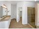 Updated bathroom featuring a modern vanity, a glass-enclosed shower, and contemporary fixtures at 7292 Firethorn, Littleton, CO 80125