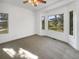 Bright bedroom with large windows offering views of mature trees at 7292 Firethorn, Littleton, CO 80125