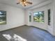 Bright bedroom with large bay windows offering great natural light and outdoor views at 7292 Firethorn, Littleton, CO 80125