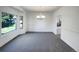 Spacious dining room featuring a modern chandelier and a large window for natural light at 7292 Firethorn, Littleton, CO 80125