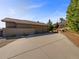 Spacious home with a long driveway and three-car garage at 7292 Firethorn, Littleton, CO 80125