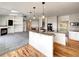 Modern kitchen featuring granite countertops, pendant lighting, and stainless steel appliances at 7292 Firethorn, Littleton, CO 80125