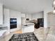 Modern kitchen featuring white cabinets, granite countertops, and stainless steel appliances at 7292 Firethorn, Littleton, CO 80125