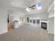 Bright living room showcasing vaulted ceilings, skylights, and fireplace at 7292 Firethorn, Littleton, CO 80125