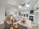 Bright living room with fireplace, skylights, and access to the outdoor deck at 7292 Firethorn, Littleton, CO 80125