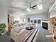 Bright living room showcasing vaulted ceilings, skylights, and fireplace at 7292 Firethorn, Littleton, CO 80125