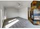 Bright living room featuring a fireplace and a large window for natural light at 7292 Firethorn, Littleton, CO 80125