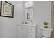Modern bathroom with updated vanity, mirror, and lighting at 10001 E Evans Ave # 58B, Aurora, CO 80247
