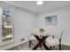 Cozy dining area with seating for two, bright light and window view at 10001 E Evans Ave # 58B, Aurora, CO 80247
