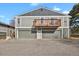 Exterior shot of home with balcony and multiple car garage at 10001 E Evans Ave # 58B, Aurora, CO 80247