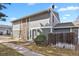 Two-story home featuring stone accents, neutral siding, and a well-kept lawn and walkway at 10001 E Evans Ave # 58B, Aurora, CO 80247