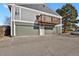 Inviting condo exterior with two-car garage and a charming second-story balcony, offering additional outdoor living space at 10001 E Evans Ave # 58B, Aurora, CO 80247