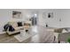 Bright living room with wood flooring, modern furnishings, and a sliding glass door at 10001 E Evans Ave # 58B, Aurora, CO 80247