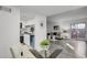 Bright living space with dining area, kitchen pass-through and wood flooring throughout at 10001 E Evans Ave # 58B, Aurora, CO 80247