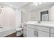Sparkling clean bathroom featuring a shower over tub and a white vanity at 1632 Saddlesmith Pl, Castle Pines, CO 80108