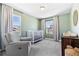 Calming Bedroom featuring a crib, a comfortable chair, and natural light at 1632 Saddlesmith Pl, Castle Pines, CO 80108