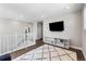 Upper level bonus room with a contemporary rug, large windows, and open layout at 1632 Saddlesmith Pl, Castle Pines, CO 80108