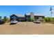 Community clubhouse with ample parking and well-maintained landscaping at 1632 Saddlesmith Pl, Castle Pines, CO 80108