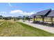 Community park featuring a playground and picnic pavilion for outdoor recreation at 1632 Saddlesmith Pl, Castle Pines, CO 80108