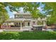 Entertainer's backyard with a covered outdoor kitchen, hot tub, and a cozy seating area with a fire pit at 5046 Sage Brush Dr, Broomfield, CO 80023