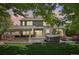 Resort-style backyard featuring a hot tub, outdoor kitchen, and a cozy seating area with a fire pit at 5046 Sage Brush Dr, Broomfield, CO 80023