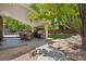 Beautiful backyard with a covered patio, outdoor grill, and lush green space ideal for outdoor activities at 5046 Sage Brush Dr, Broomfield, CO 80023
