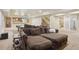 Spacious basement features a comfortable sitting area, pool table, and kitchenette for entertaining at 5046 Sage Brush Dr, Broomfield, CO 80023