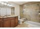 Bathroom featuring a walk-in shower with marble detail, a granite vanity, and tile flooring at 5046 Sage Brush Dr, Broomfield, CO 80023