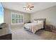 Bedroom with neutral tones, a ceiling fan, and a window for natural light at 5046 Sage Brush Dr, Broomfield, CO 80023