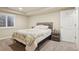 Bedroom with an accent wall, a large window, and a ceiling fan at 5046 Sage Brush Dr, Broomfield, CO 80023
