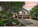 Charming two-story home with a three-car garage, mature landscaping, and a basketball hoop at 5046 Sage Brush Dr, Broomfield, CO 80023