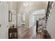 Open foyer with high ceilings, wood floors, and view into adjacent rooms at 5046 Sage Brush Dr, Broomfield, CO 80023