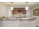 Stylish kitchenette features granite countertops, custom cabinetry, and a convenient wine rack at 5046 Sage Brush Dr, Broomfield, CO 80023