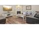 Cozy living room featuring a fireplace, stylish decor, and comfortable seating at 5046 Sage Brush Dr, Broomfield, CO 80023
