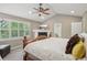 Comfortable main bedroom with a fireplace and a large window for natural light at 5046 Sage Brush Dr, Broomfield, CO 80023