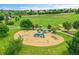 Community playground with slides and swings, a covered picnic area and gorgeous mountain views in the distance at 11268 Grove St # I, Westminster, CO 80031