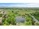 Gorgeous aerial view of community pond, park and surroundings with stunning mountain views in the distance at 11268 Grove St # I, Westminster, CO 80031