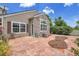 View of the backyard featuring a stone patio and mature landscaping at 11268 Grove St # I, Westminster, CO 80031