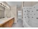 Bright bathroom with double vanity, tile floors, and a combined shower and tub at 11268 Grove St # I, Westminster, CO 80031