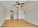 Spacious bedroom featuring hardwood floors, neutral walls, and an open doorway at 11268 Grove St # I, Westminster, CO 80031