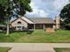 Charming brick clubhouse surrounded by a well-maintained lawn and mature trees at 11268 Grove St # I, Westminster, CO 80031