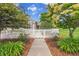 Charming home featuring a white picket fence, beautiful landscaping, and a welcoming entrance at 11268 Grove St # I, Westminster, CO 80031