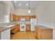 Well-lit kitchen with light wood cabinets, modern appliances, and hardwood floors at 11268 Grove St # I, Westminster, CO 80031