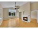 Cozy living room featuring a fireplace, hardwood floors, and large windows at 11268 Grove St # I, Westminster, CO 80031