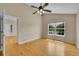 Bright living room featuring hardwood floors, a ceiling fan, and plenty of natural light at 11268 Grove St # I, Westminster, CO 80031